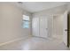 Bedroom featuring neutral walls, tile flooring, and sliding closet doors at 2433 Cingoli St, Henderson, NV 89044