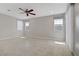Bright, spacious bedroom with tile floors, recessed lighting, and large windows offering plenty of natural light at 2433 Cingoli St, Henderson, NV 89044