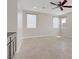 Spacious bedroom with a ceiling fan and plenty of natural light from large windows at 2433 Cingoli St, Henderson, NV 89044