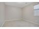 Bedroom featuring neutral walls, tile flooring, and a window with shades at 2433 Cingoli St, Henderson, NV 89044