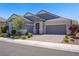 Lovely single-story home boasting a three-car garage, manicured landscaping, and neutral paint at 2433 Cingoli St, Henderson, NV 89044