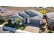 Charming single-story gray home with a three-car garage and landscaped front yard at 2433 Cingoli St, Henderson, NV 89044