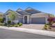 Beautiful single story home with lush landscaping and a three car garage at 2433 Cingoli St, Henderson, NV 89044