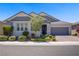 Charming single story home boasts manicured landscaping and a brick driveway at 2433 Cingoli St, Henderson, NV 89044