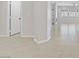 Hallway view towards the open living space, showcasing the tile flooring and open layout of the home at 2433 Cingoli St, Henderson, NV 89044