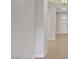 Hallway with tile flooring leads to the front door with decorative glass and sidelights, offering a bright entry at 2433 Cingoli St, Henderson, NV 89044