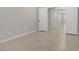 Open hallway featuring neutral walls, tile flooring, and white doors at 2433 Cingoli St, Henderson, NV 89044