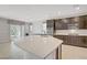 Bright kitchen with sleek countertops, stainless steel appliances, and sliding glass doors at 2433 Cingoli St, Henderson, NV 89044