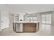 Bright kitchen features stainless steel appliances and a large center island at 2433 Cingoli St, Henderson, NV 89044