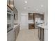 Beautiful, bright kitchen with stainless steel appliances, and dark brown cabinets at 2433 Cingoli St, Henderson, NV 89044