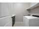 Laundry room featuring a washer and dryer, as well as a utility sink at 2433 Cingoli St, Henderson, NV 89044