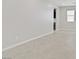 Empty living space with tile floors and recessed lights. One window with blinds can be seen in the corner of the room at 2433 Cingoli St, Henderson, NV 89044