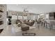 Open concept living room is virtually staged with modern furnishings and neutral colors at 2433 Cingoli St, Henderson, NV 89044