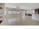 Bright, open living space with tile flooring, recessed lighting, and multiple windows providing ample natural light at 2433 Cingoli St, Henderson, NV 89044