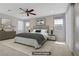 Comfortable bedroom featuring a ceiling fan, neutral tones, and ample natural light at 2433 Cingoli St, Henderson, NV 89044