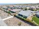 Aerial view showcasing a well-maintained backyard with a pool and an outdoor seating area, surrounded by lush landscaping at 2489 Cingoli St, Henderson, NV 89044