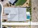 Property overview highlighting the backyard with a pool, outdoor seating, artificial grass, and lush landscaping at 2489 Cingoli St, Henderson, NV 89044