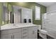 Bright bathroom features a modern vanity, sleek fixtures, and a glass-enclosed shower for a refreshing experience at 2489 Cingoli St, Henderson, NV 89044