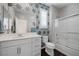 Well-lit bathroom with modern fixtures, a white vanity, and a glass-enclosed shower for a spa-like experience at 2489 Cingoli St, Henderson, NV 89044