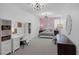 Bright bedroom featuring stylish light fixtures, a comfortable bed, and ample space for relaxation at 2489 Cingoli St, Henderson, NV 89044