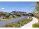 View of the neighborhood gate and surrounding landscaping, showcasing a well-maintained community entrance at 2489 Cingoli St, Henderson, NV 89044