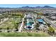 Community park featuring playgrounds, picnic areas, sports field, and lush green spaces for outdoor activities at 2489 Cingoli St, Henderson, NV 89044