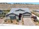 Charming single-story home features a well-manicured front yard and a brick driveway leading to an attached garage at 2489 Cingoli St, Henderson, NV 89044