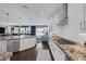Beautiful kitchen featuring stainless steel appliances, granite countertops, a large center island, and natural light at 2489 Cingoli St, Henderson, NV 89044