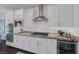 Modern kitchen showcasing white cabinetry, stainless steel appliances, granite countertops, and ample storage at 2489 Cingoli St, Henderson, NV 89044