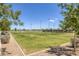 Scenic view of a community volleyball court, surrounded by lush greenery and clear blue skies at 2489 Cingoli St, Henderson, NV 89044