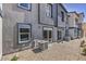 The backyard features a gravel area with an air conditioning unit and direct access to the home via sliding glass doors at 2534 Petunia Garden St # 222, North Las Vegas, NV 89081