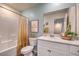 Bright bathroom featuring modern vanity, framed wall art, and shower with bathtub at 2534 Petunia Garden St # 222, North Las Vegas, NV 89081