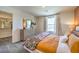 Comfortable bedroom featuring a window, dresser, and walk-in closet at 2534 Petunia Garden St # 222, North Las Vegas, NV 89081