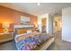 Comfortable bedroom featuring a window, night stands and walk-in closet at 2534 Petunia Garden St # 222, North Las Vegas, NV 89081