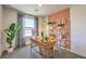 Bright office area with desk, chair, modern shelving and large window with nice curtains at 2534 Petunia Garden St # 222, North Las Vegas, NV 89081