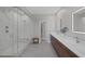 Modern bathroom with a glass-enclosed shower, dual vanities, and contemporary fixtures at 2631 Chance Canyon St, Henderson, NV 89044