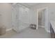 Elegant bathroom featuring a glass shower, a bench, and modern fixtures at 2631 Chance Canyon St, Henderson, NV 89044
