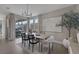 Inviting dining area with large windows and sliding door access to the outdoors at 2631 Chance Canyon St, Henderson, NV 89044