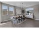 Elegant dining room with natural light, modern chandelier, and stylish decor at 2631 Chance Canyon St, Henderson, NV 89044