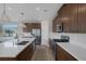 Well-equipped kitchen with ample counter space, stainless steel appliances, and stylish cabinetry at 2631 Chance Canyon St, Henderson, NV 89044
