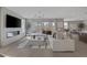 Open-concept living room showcasing a modern fireplace, large sectional sofa, stylish decor, and abundant natural light at 2631 Chance Canyon St, Henderson, NV 89044