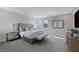 Spacious main bedroom featuring neutral tones, carpet, and natural light from multiple windows at 2631 Chance Canyon St, Henderson, NV 89044