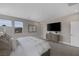 Serene main bedroom featuring a TV, and neutral tones with natural light from windows at 2631 Chance Canyon St, Henderson, NV 89044