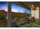 Outdoor patio area with a fire pit, seating, and an outdoor dining space at 2631 Chance Canyon St, Henderson, NV 89044