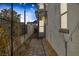 Charming walkway with brick pavers, decorative lighting, iron fencing and lush landscaping leading to the home's entrance at 2631 Chance Canyon St, Henderson, NV 89044