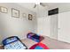 Bedroom with carpet floors, large window, toddler beds, ceiling fan, and closet at 2672 Painted Mist Ct, Las Vegas, NV 89142