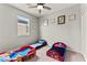 Bedroom featuring toddler beds, natural light from windows, carpet flooring, and light gray walls at 2672 Painted Mist Ct, Las Vegas, NV 89142