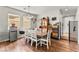 Cozy dining room with hardwood floors, chandelier, and ample natural light at 2672 Painted Mist Ct, Las Vegas, NV 89142