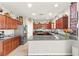 Spacious kitchen with stainless steel appliances, a large countertop, and updated fixtures at 2672 Painted Mist Ct, Las Vegas, NV 89142
