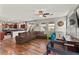 Open-concept living space with hardwood floors seamlessly connecting to kitchen at 2672 Painted Mist Ct, Las Vegas, NV 89142